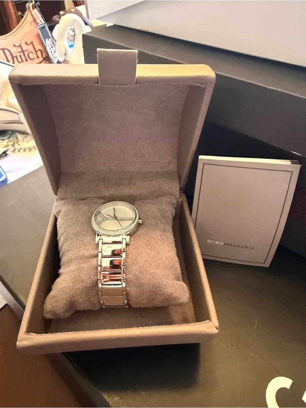 BCBGMAXAZRIA silver watch with diamond accents. Needs battery.